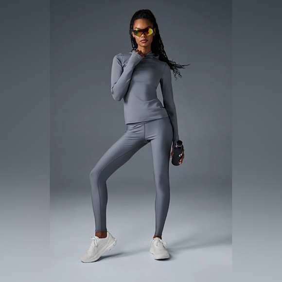 Alo Yoga Airlift Warm Hooded Runner in gray with a brushed interior for warmth. - Picture 2 of 6